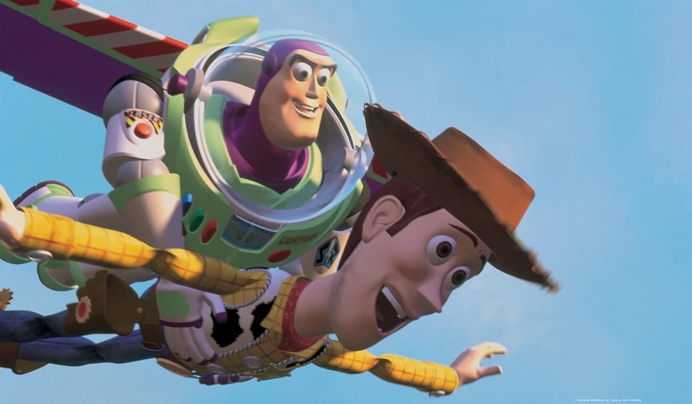 Buzz Lightyear and Woody soaring through the sky together, with Buzz holding Woody as they fly, from Pixar’s Toy Story.