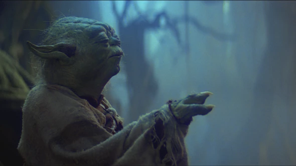 Yoda, the Jedi Master from Star Wars, stands in the misty swamps of Dagobah with his eyes closed and one arm raised, as if using the Force