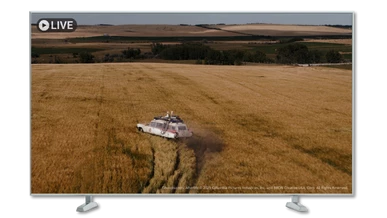The Ghostbusters car is speeding through a field of corn. Ghostbusters Afterlife is covered by the Filmbankmedia Blanket Licence