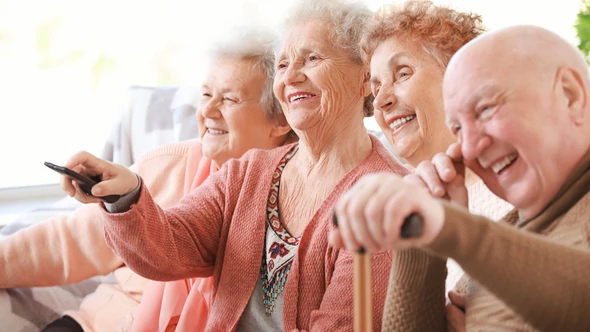 Residents of a Care Home are laughing and enjoying watch a film_Annual Screening Licence for Care Homes