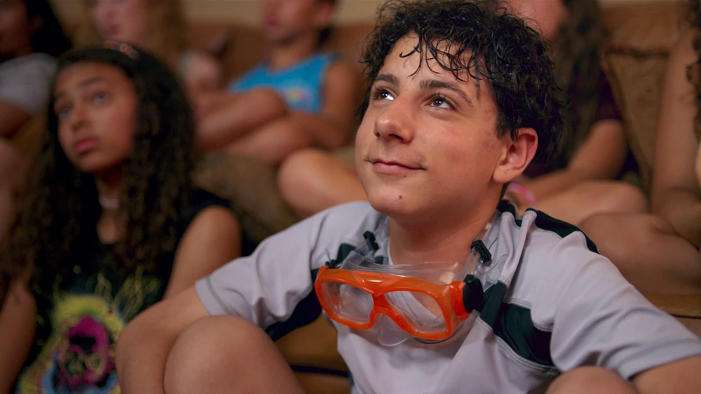 In coming-of-age film, Eighth Grade, Gabe (Jake Ryan) looks up at Kayla (Elsie Fisher) with love