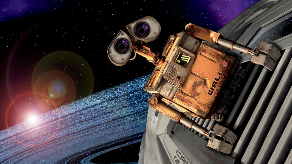 WALL-E, the little robot is gliding through space.